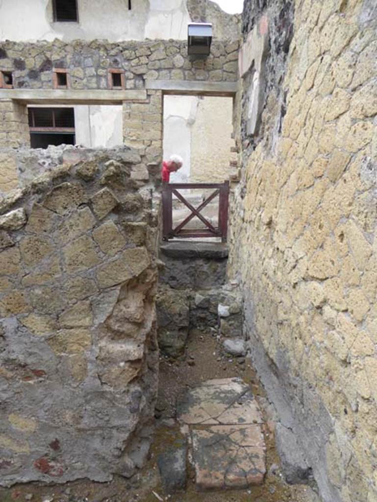 IV.8 Herculaneum, October 2015. Looking west into latrine, which would have been under the stairs, entered at IV.9. Photo courtesy of Michael Binns.
